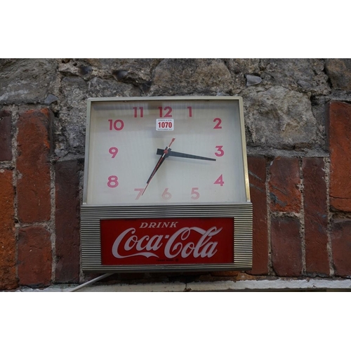 1070 - Advertising: a vintage Coca-Cola electric wall clock, by Synchron, 28cm wide.