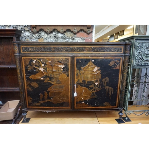 1077 - A Regency ebonized and gilt chinoiserie lacquered side cabinet, 121cm wide, (a.f.).... 