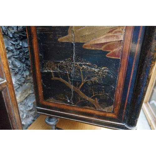 1077 - A Regency ebonized and gilt chinoiserie lacquered side cabinet, 121cm wide, (a.f.).... 