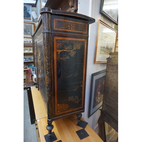 1077 - A Regency ebonized and gilt chinoiserie lacquered side cabinet, 121cm wide, (a.f.).... 