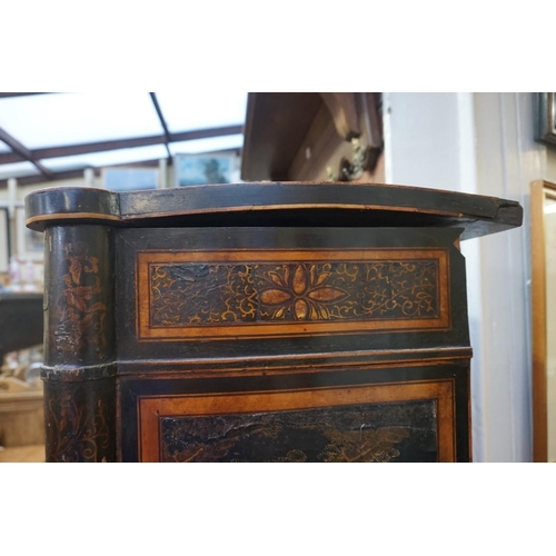 1077 - A Regency ebonized and gilt chinoiserie lacquered side cabinet, 121cm wide, (a.f.).... 