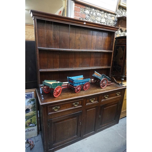 1079 - A George III oak dresser and rack, 155cm wide. 