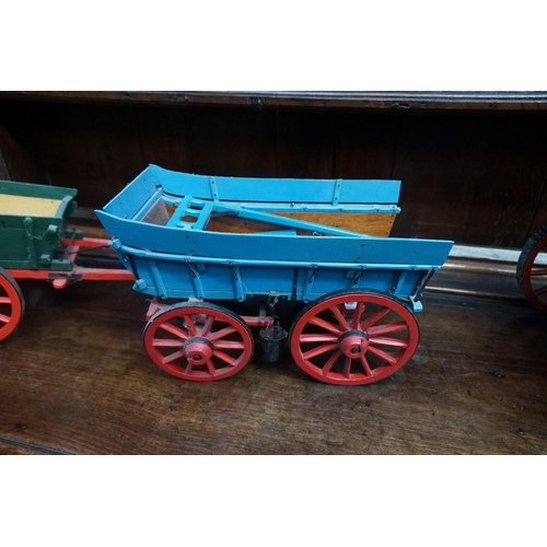 1080 - Three scratch built painted wood wagons, largest 62cm long. (3)