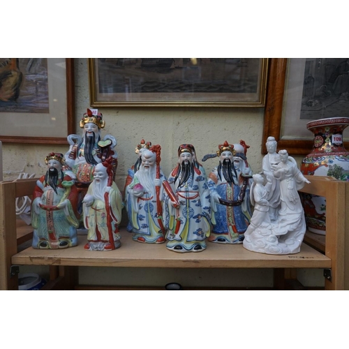 1102 - Nine Chinese famille rose figures, largest 35cm high; together with two further blanc de chine figur... 