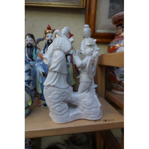 1102 - Nine Chinese famille rose figures, largest 35cm high; together with two further blanc de chine figur... 