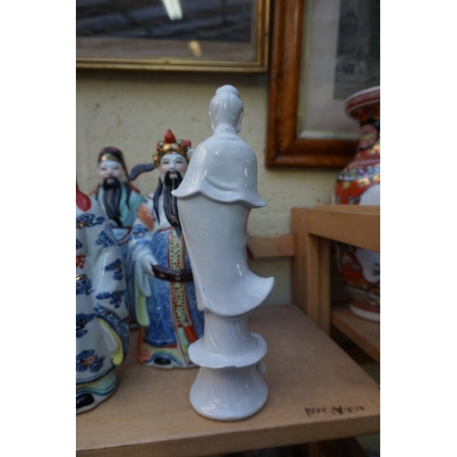 1102 - Nine Chinese famille rose figures, largest 35cm high; together with two further blanc de chine figur... 