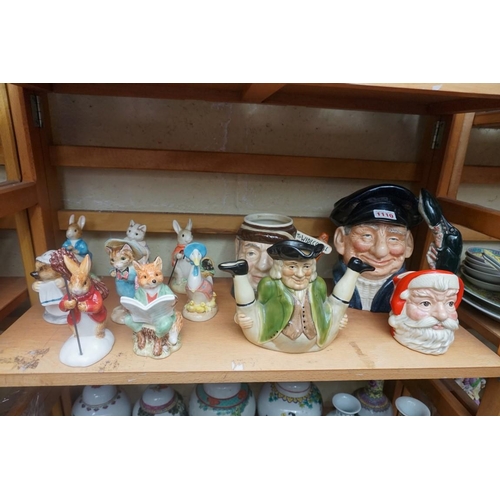 1110 - Eight Border Fine Arts 'Beatrix Potter' figures; together with two Royal Doulton character jugs; and... 