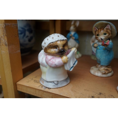 1110 - Eight Border Fine Arts 'Beatrix Potter' figures; together with two Royal Doulton character jugs; and... 