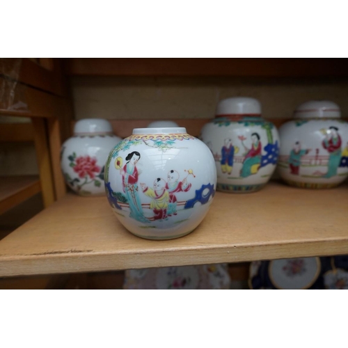 1111 - A collection of Chinese famille rose vases and jars, largest 17cm high. (12)