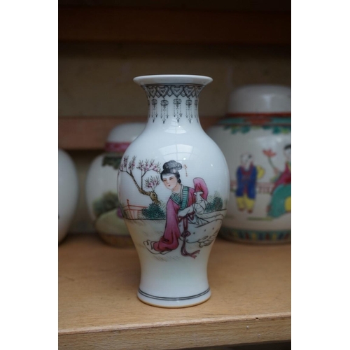 1111 - A collection of Chinese famille rose vases and jars, largest 17cm high. (12)