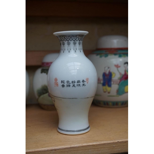 1111 - A collection of Chinese famille rose vases and jars, largest 17cm high. (12)