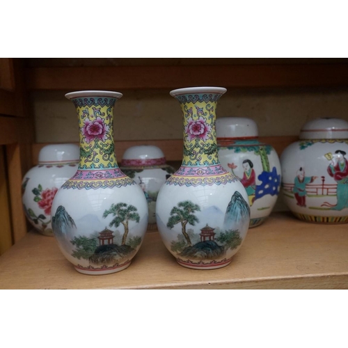 1111 - A collection of Chinese famille rose vases and jars, largest 17cm high. (12)