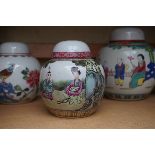 1111 - A collection of Chinese famille rose vases and jars, largest 17cm high. (12)