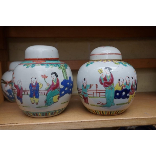 1111 - A collection of Chinese famille rose vases and jars, largest 17cm high. (12)