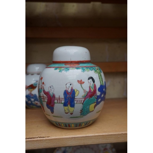 1111 - A collection of Chinese famille rose vases and jars, largest 17cm high. (12)