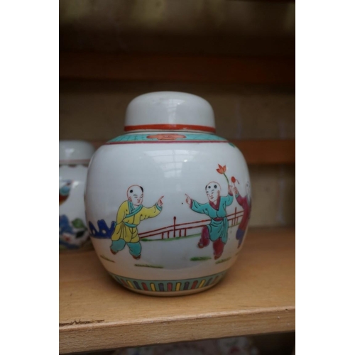 1111 - A collection of Chinese famille rose vases and jars, largest 17cm high. (12)