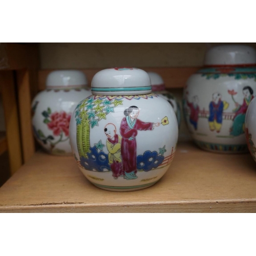 1111 - A collection of Chinese famille rose vases and jars, largest 17cm high. (12)