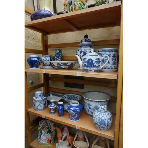 1115 - A collection of Chinese and Japanese blue and white ceramics, largest 25cm. (16)... 