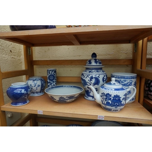 1115 - A collection of Chinese and Japanese blue and white ceramics, largest 25cm. (16)... 