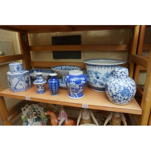 1115 - A collection of Chinese and Japanese blue and white ceramics, largest 25cm. (16)... 