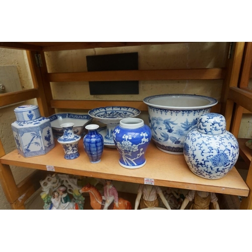 1115 - A collection of Chinese and Japanese blue and white ceramics, largest 25cm. (16)... 