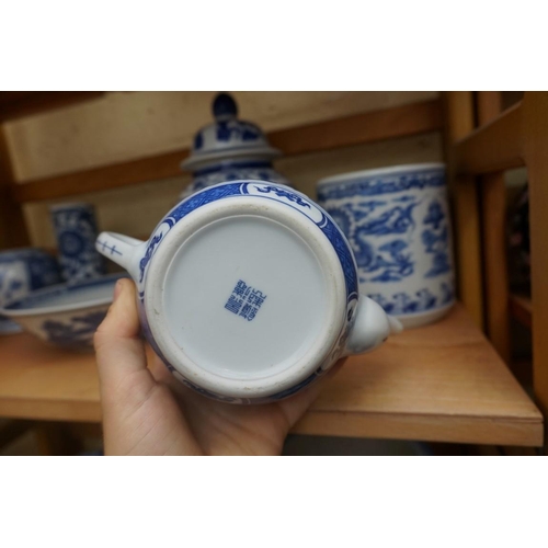 1115 - A collection of Chinese and Japanese blue and white ceramics, largest 25cm. (16)... 