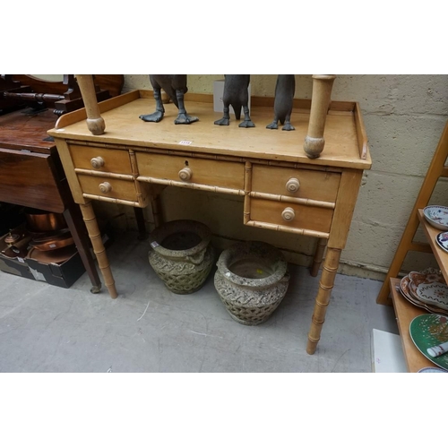 1119 - A Victorian pine and simulated bamboo kneehole dressing table, 94cm wide.