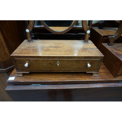 1125 - Three George III mahogany box base toilet mirrors, two with bone handles; together with another 19th... 