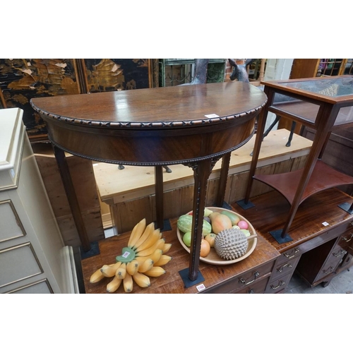 1160 - A 1920s mahogany demi-lune card table, 84cm wide.