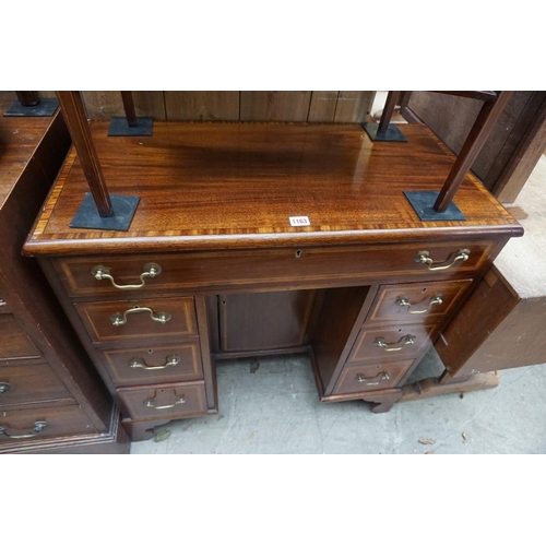 1163 - A mahogany and crossbanded kneehole chest, 81.5cm wide.