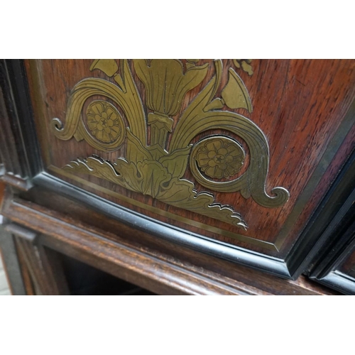 1172 - An oak standing corner cupboard, the upper part comprising a pair of 19th century rosewood and brass... 