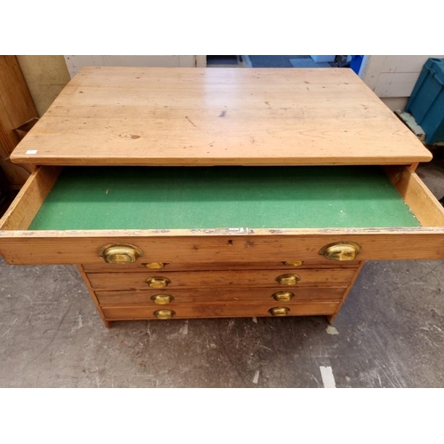 1182 - An antique pine seven drawer plan chest, 106.5cm wide.