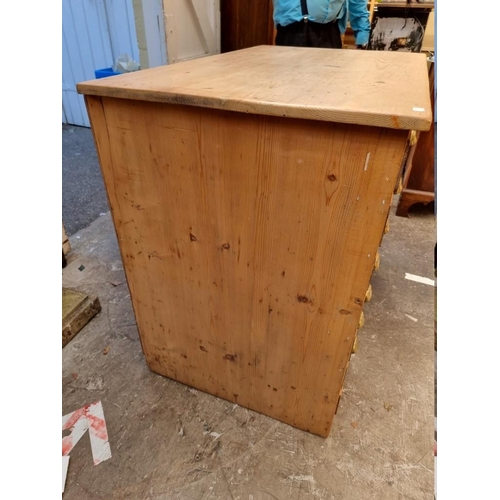 1182 - An antique pine seven drawer plan chest, 106.5cm wide.