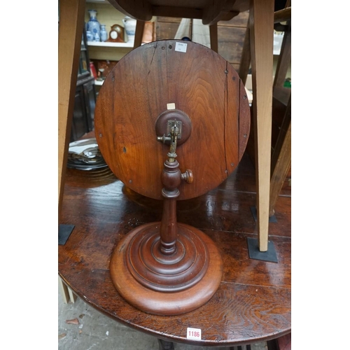 1190 - A Victorian turned mahogany adjustable shaving mirror, 35.5cm diameter. 