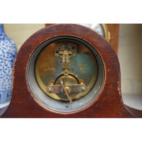 1214 - An early 20th century mahogany and satinwood banded mantel clock, the silvered chapter ring inscribe... 