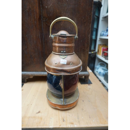 1223 - A copper ship's lantern; together with a similar brass example. (2)