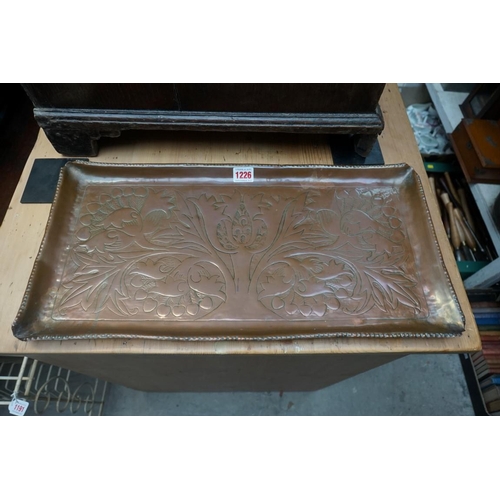 1226 - A Newlyn style copper rectangular tray, 54cm wide; and two others. (3) 