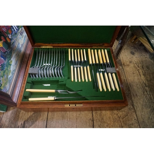 1285 - An oak canteen of electroplated cutlery; together with another similar empty canteen box. ... 