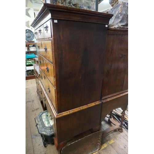 1358 - A George I walnut and feathered banded chest on stand, 110.5cm wide. 