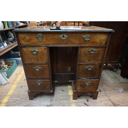 1379 - An 18th century walnut and featherbanded kneehole chest, 79cm wide.