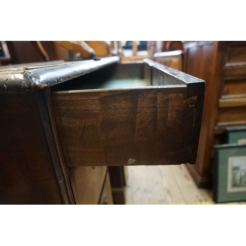 1379 - An 18th century walnut and featherbanded kneehole chest, 79cm wide.