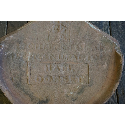 1388 - A set of three Reed Patent terracotta roof tiles, inscribed 'Ham, Dorset', of spade form, 41 x 30cm.... 