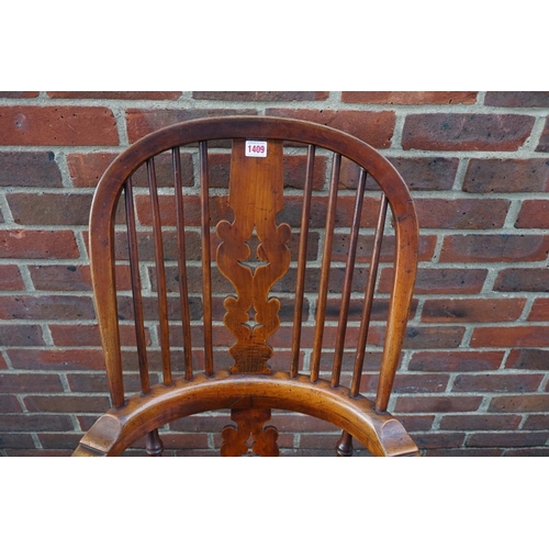 1409 - A Victorian ash, elm and fruitwood high back Windsor armchair. 