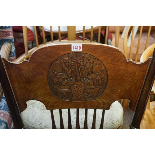 1410 - A early 20th century beechwood and elm armchair, with saddle seat. 