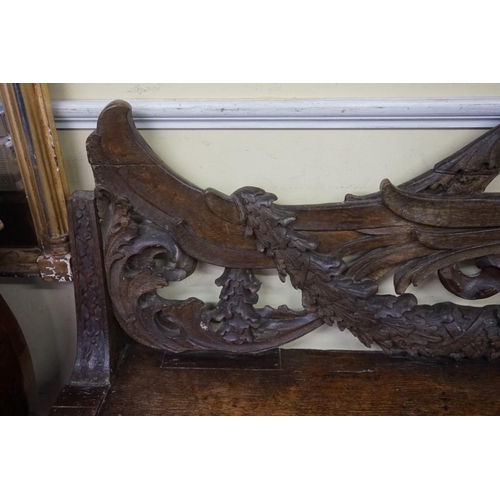 1429 - A large and unusual 19th century Continental carved walnut hall bench, probably Italian, 236.5cm wid... 