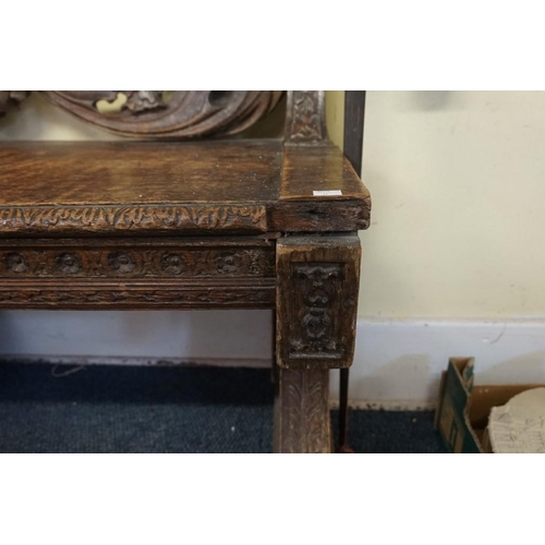 1429 - A large and unusual 19th century Continental carved walnut hall bench, probably Italian, 236.5cm wid... 