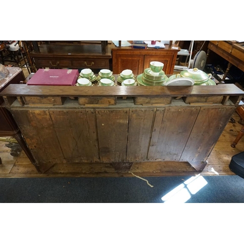 1435 - A George III oak dresser base, of inverted breakfront form, 168.5cm wide,