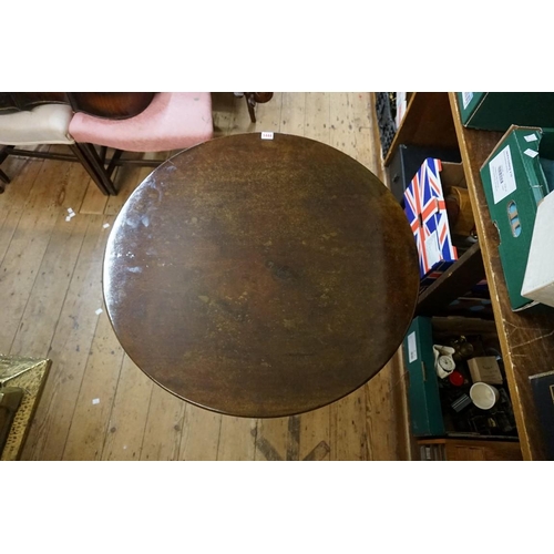 1444 - A George III mahogany circular tilt top tripod table, with one piece top, 74cm diameter, (repairs to... 