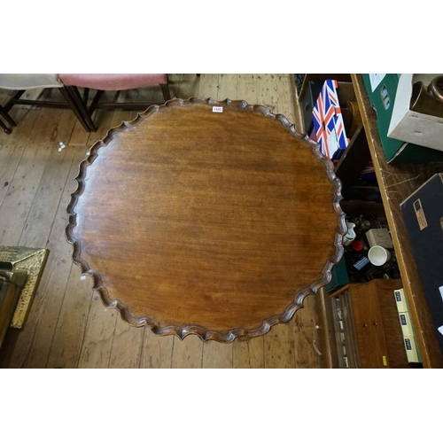 1445 - A George III mahogany piecrust tilt top tripod table, with one piece top and ball and claw feet, 75c... 