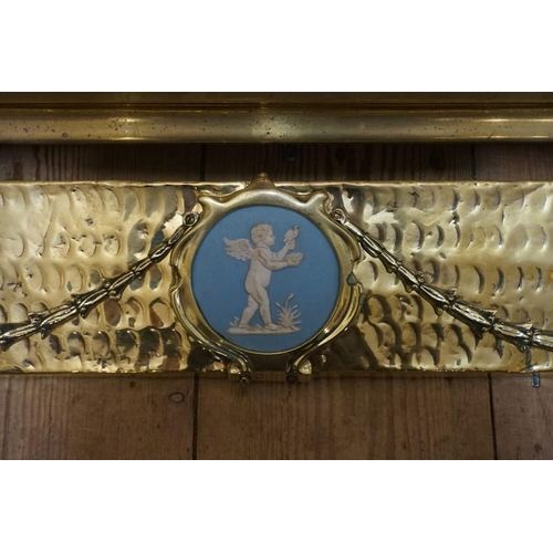 1446 - A Victorian brass fender, with inset Wedgwood Jasperware plaque, 138cm wide; together with another V... 